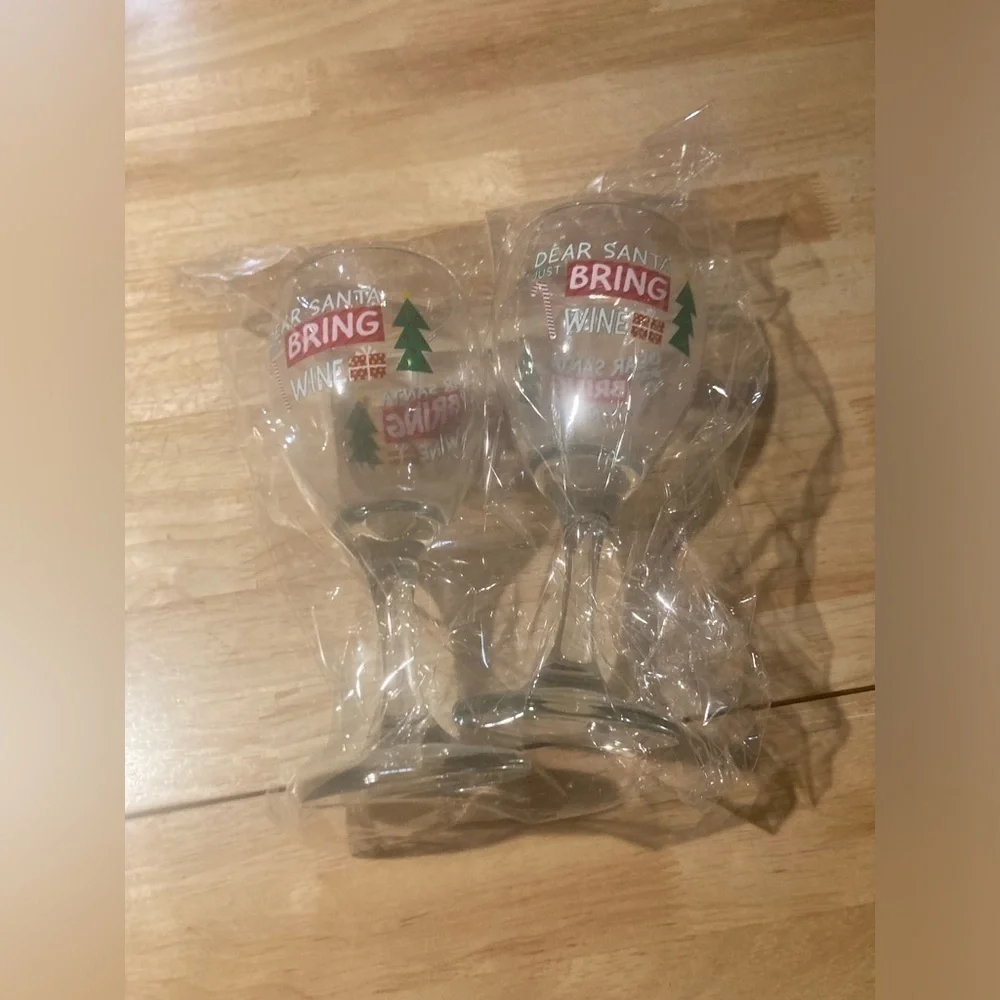 4/$25 Christmas wine glasses that say Dear Santa bring wine. Never used